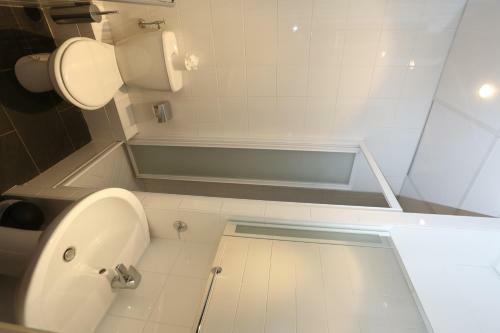 Apartamento O'sullivans Bar And Hotel