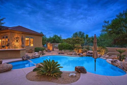Oasis In The Desert Near Boulders