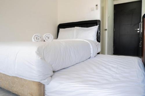 Homey Studio Puri Mas Apartment By Travelio