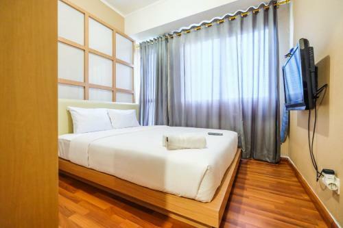 Comfortable 1br The Oasis Lippo Cikarang Apartment By Travelio