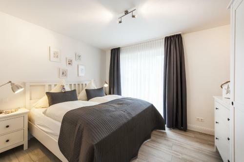 Apartamento Ferienwohnung "b�sumer Reethus"