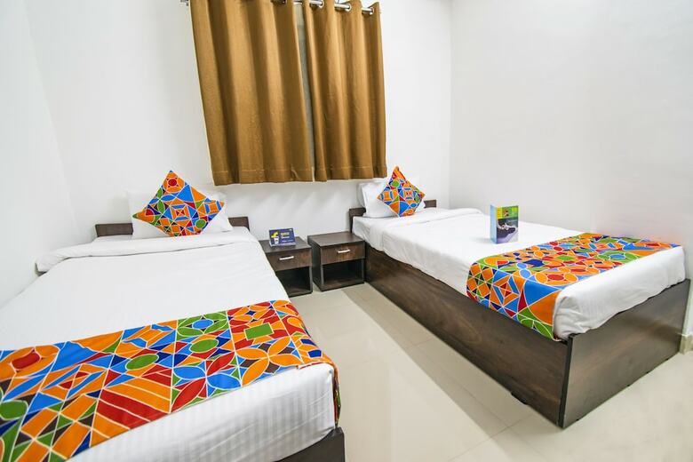 Fabhotel Purple Orchid