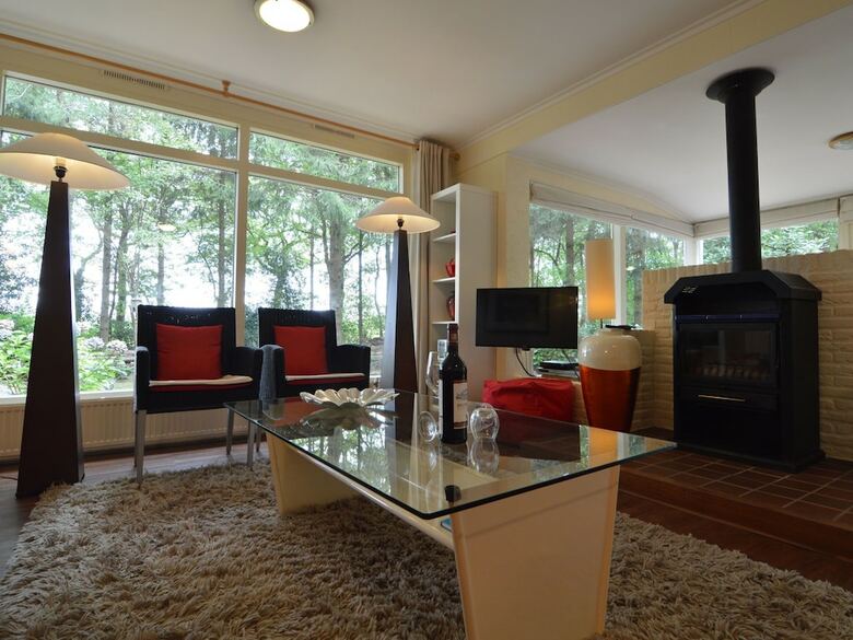 A Detached Bungalow With Outdoor Fireplace, Covered Terrace And Pond In A Forest Plot