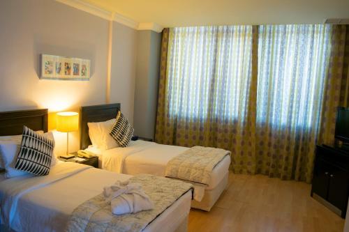 Corniche Suites Hotel
