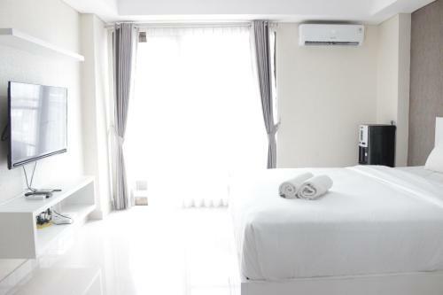 Comfy Studio Apartment At Tamansari Tera Residence By Travelio