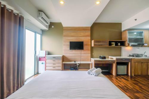 Modern And Cozy Studio Park View Apartment By Travelio