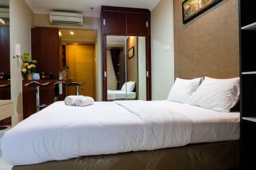 Comfy Studio Signature Park Apartment By Travelio