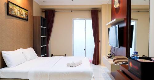Comfy Studio Signature Park Apartment By Travelio