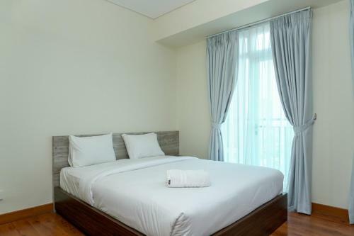 Modern And Comfy Studio Puri Orchard Apartment By Travelio