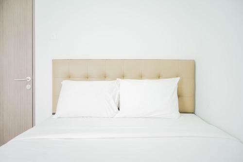 Minimalist 2br At Emerald Bintaro Apartment By Travelio