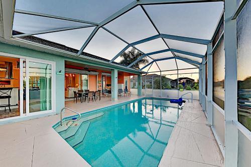 Lavish Canal-front Getaway With Heated Pool & Dock Home
