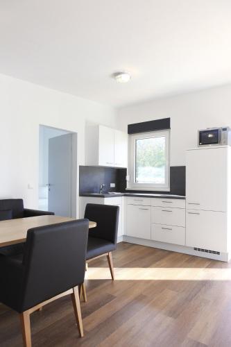 Hostal Gasthof Pension Wei�es R�ssl