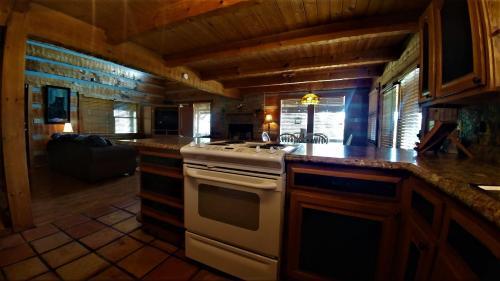 Free Xplorie Attractions Every Day! - Driftwood Log Cabin