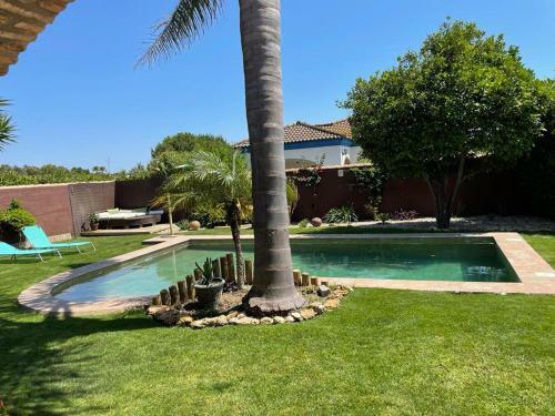 Two-bed Villa With Tropical Garden In Chiclana