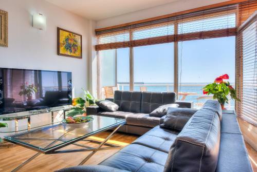House Touching The Sea