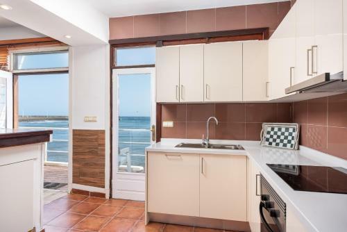 House Touching The Sea