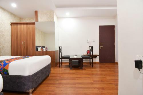 Fabhotel Dhanvitha Suites