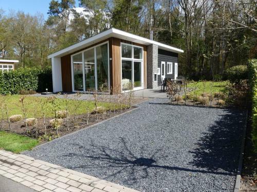 Modern Chalet With Outdoor Fireplace At The Forest