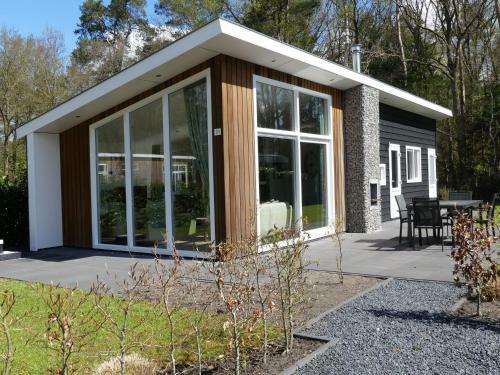 Modern Chalet With Outdoor Fireplace At The Forest