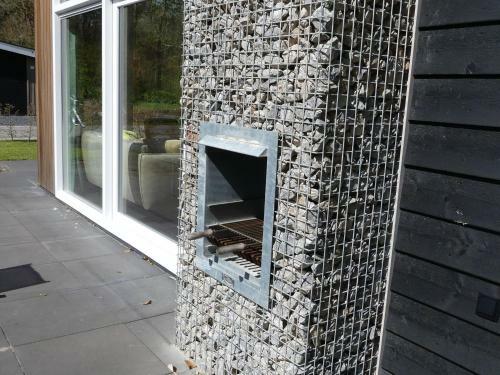 Modern Chalet With Outdoor Fireplace At The Forest