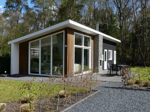 Modern Chalet With Outdoor Fireplace At The Forest