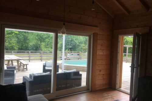 Wooden House With Pool And Garden With Trees