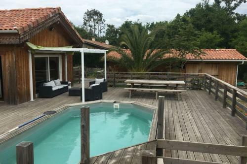 Wooden House With Pool And Garden With Trees