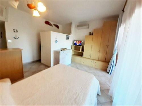 Lovely Holiday Home In Marinella With Shared Garden
