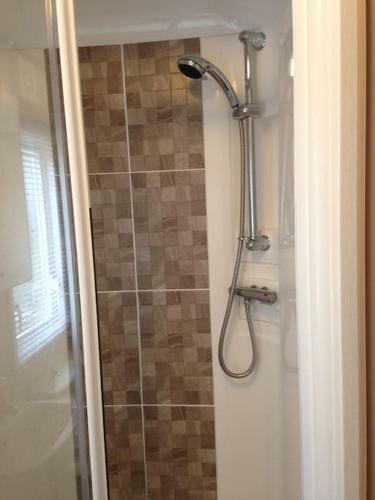 Woodpecker Lodge, Camelot Holiday Park, Ca6 5sz