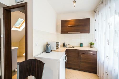 Siesta Sziget - Panor�m�s Balatonparti Apartmanok
