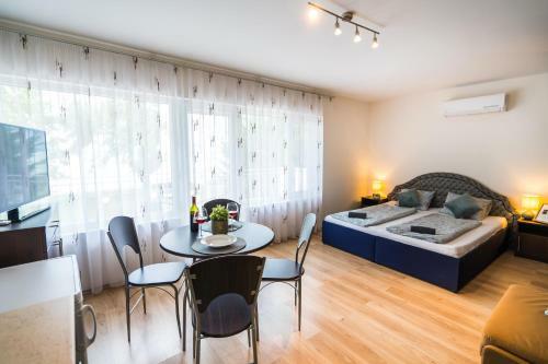 Siesta Sziget - Panor�m�s Balatonparti Apartmanok