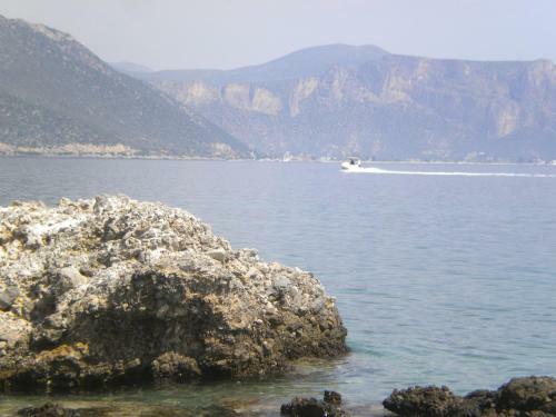 Amygdalia, A Stone House In A Quiet Landscape