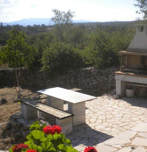 Amygdalia, A Stone House In A Quiet Landscape
