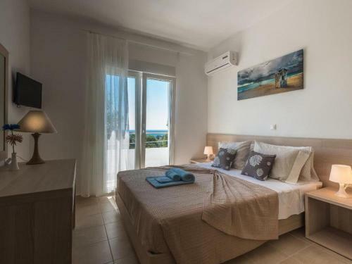 Attractive Holiday Home In Gennadi With Shared Swimming Pool