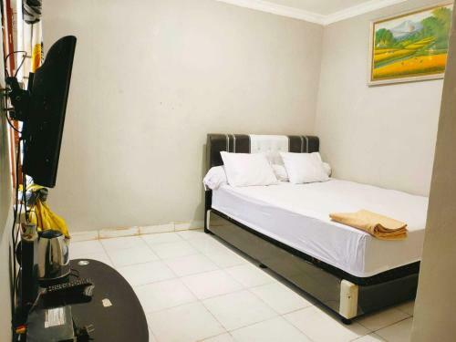 Hotel Express O 91277 Atiq Homestay Syariah
