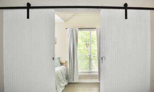 Lovely Barn Door Sunroom!