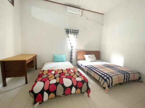 Hostal Homey Guesthouse Kertajaya (Syariah)