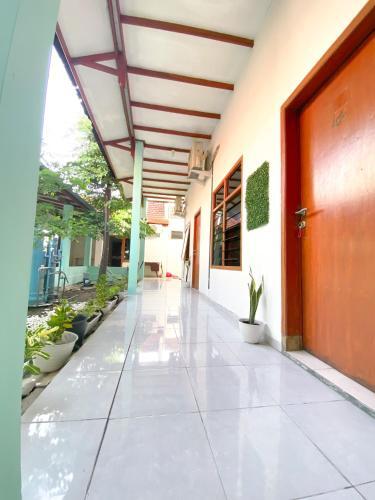 Hostal Homey Guesthouse Kertajaya (Syariah)