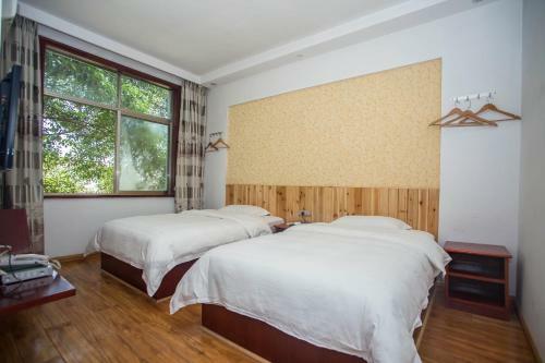 Posada Zhangjiajie Yijiaqin Hotel