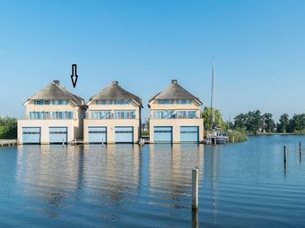Exclusive Holiday Home Floating On A Lake In Friesland