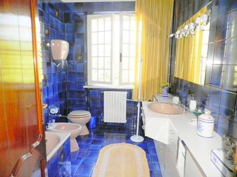 On Top Of A Hill Surrounded By Greenery, Close To Town In A Panoramic Location