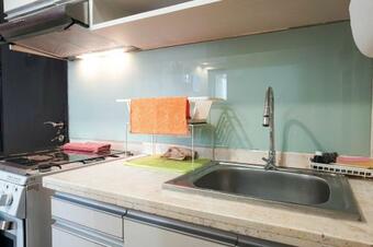 Cozy And Modern Studio Apartment At Belmont Residence Puri By Travelio